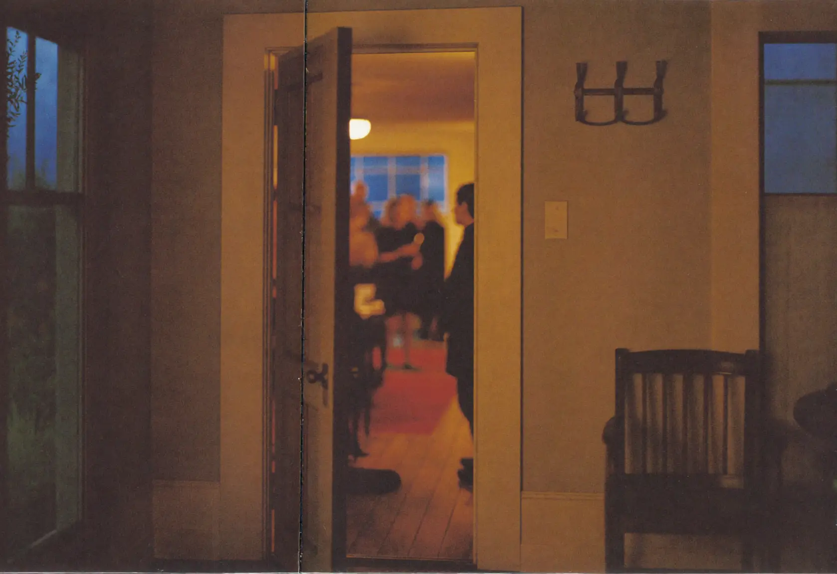 An open front door at night, a dinner party blurred behind it, an empty coat hook